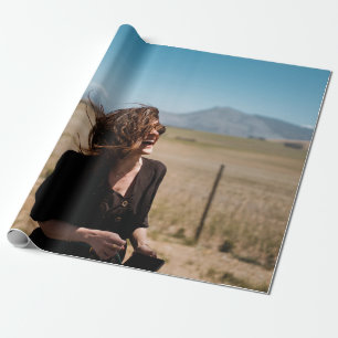 Smiling woman on brown and green field wrapping paper