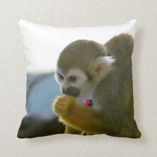 Snacking Squirrel Monkey Throw Pillow