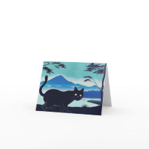 Sneaky black cat by a lake greetings card