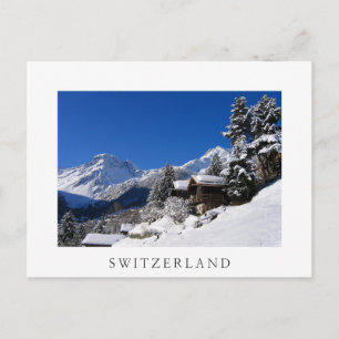 Snow-covered log cabins in Switzerland Postcard