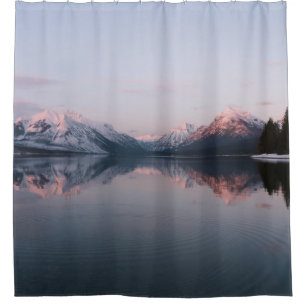 SNOW COVERED MOUNTAIN NEAR LAKE DURING DAYTIME