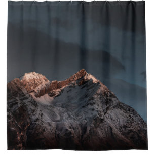 SNOW COVERED MOUNTAIN UNDER BLUE SKY DURING DAYTIM
