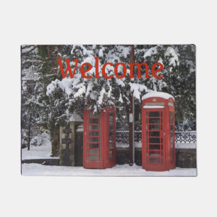 snow covered old red phone boxes doormat