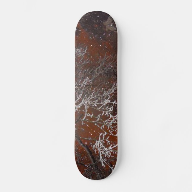 Snow Covered Tree Branches Against Red Storm Sky Skateboard (Front)
