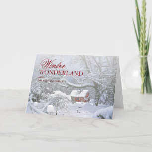 Snow covers landscape and red barn in distance. holiday card