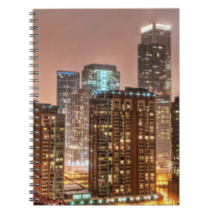 Snow falls over skyline at evening in Chicago Notebook