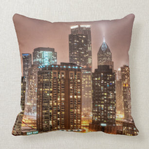 Snow falls over skyline at evening in Chicago Throw Pillow