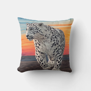 Snow Leopard Walking on the Beach During a Sunset Throw Pillow