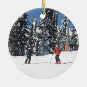 Snow Scene with Skiers and Snow Covered Trees Ceramic Ornament