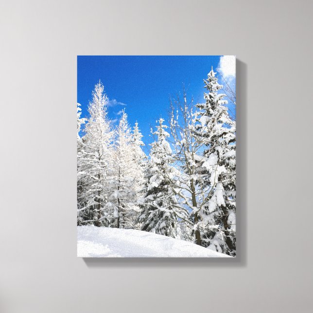 Snow trees under a clear blue sky canvas print (Front)