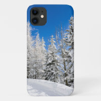 Snow trees under a clear blue sky
