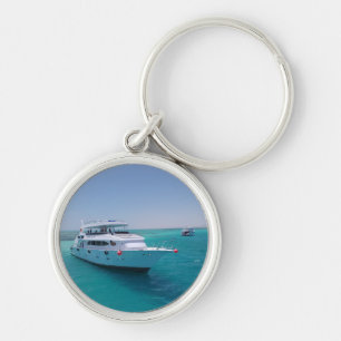 Snow-white yacht near the White Island in Red Sea Keychain