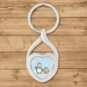 Snowballing penguins keychain