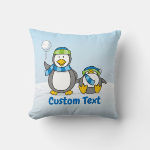 Snowballing penguins throw pillow