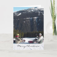 Snowboarders with a Scenic Mountain View
