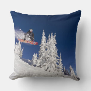 Snowboarding action at Whitefish Mountain Resort Throw Pillow
