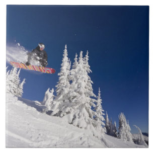 Snowboarding action at Whitefish Mountain Resort Tile