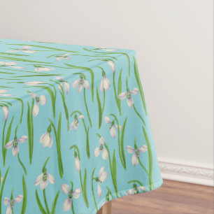 Snowdrops on pool blue tablecloth