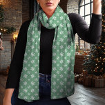 Snowflake Green and White Christmas Scarf<br><div class="desc">Embrace the winter season with this elegant green and white Christmas scarf featuring a delicate snowflake pattern. The timeless green background and contrasting white snowflakes create a chic and versatile look that complements any holiday outfit. Made from lightweight chiffon, this scarf adds a touch of sophistication to your winter wardrobe...</div>