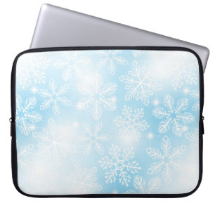 Snowflakes and lights on blue laptop sleeve