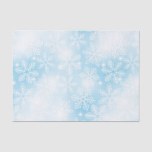Snowflakes and lights on blue tissue paper