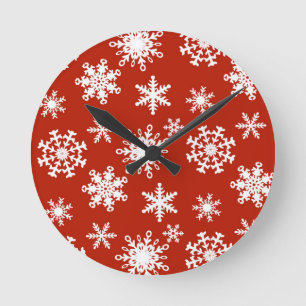 Snowflakes in white on red background round clock