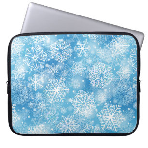 Snowflakes on blue laptop sleeve