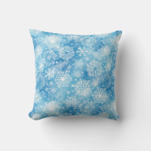 Snowflakes on blue throw pillow