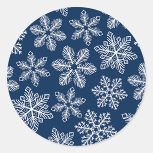 Snowflakes on dark blue classic round sticker