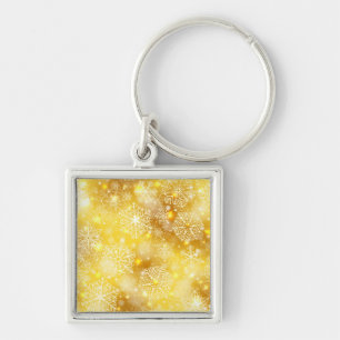 Snowflakes on golden keychain