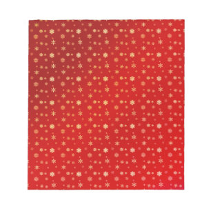 Snowflakes on red notepad