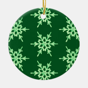 Snowflakes, pale green crystals on dark green ceramic ornament