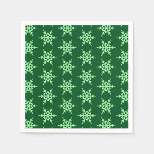 Snowflakes, pale green crystals on dark green napkin