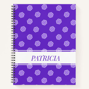 Snowflakes pattern on blue notebook