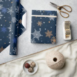 Snowflakes wrapping paper<br><div class="desc">A Blue Wrapping Paper With Gold, Silver And Blue Snowflakes Falling</div>