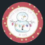 Snowman and String Lights Classic Round Sticker<br><div class="desc">Festive red and gold "made especially for you " sticker featuring my lighthearted watercolor snowman holding a string of colourful holiday lights.  Personalize text as preferred.</div>