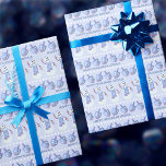 Snowman Dreidels Cute Personalized Happy Hanukkah Wrapping Paper<br><div class="desc">This cute personalized Happy Hanukkah wrapping paper in soft blues and white with snowmen and dreidels will delight kids and adults alike. Rows of happy little Jewish snowmen and tilted dreidels on a soft pastel blue background are accented with rows of white dots and your custom text in a simple...</div>