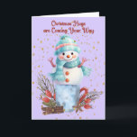 Snowman Hugs Christmas Cards<br><div class="desc">Snowman hugs Christmas card with a cute snowman standing on a container with decorations surrounding it. The words on the inside can be changed.</div>