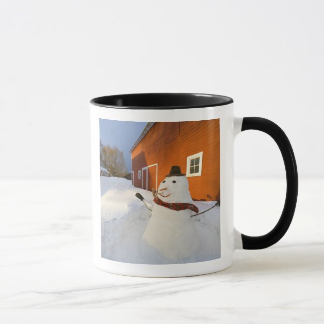 Snowman in front of red barn in Columbia Falls Mug (Right)