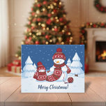 Snowman Knitting Christmas Scarf Holiday Postcard<br><div class="desc">Cartoon illustration of two adorable snowmen dressed in knitted hats and scarves. The big snowman is knitting an oversized scarf for the little one. The scarf is already wrapped several times around the cute little snowman.</div>