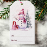 Snowman Whimsical Pink To and From Christmas Gift Tags<br><div class="desc">Add a touch of whimsy to your holiday gifts with these festive Christmas gift tags! Featuring a charming watercolor snowman in pretty pink tones, alongside wrapped presents and a snowy pine tree, these tags are sure to bring joy to your loved ones. Simply write their names in the "to" and...</div>