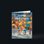 Snowmen in a Magical, Colorful Christmas Village Holiday Card<br><div class="desc">A charming, enchanting photograph capturing two adorable, small snowmen standing together in a snowy street scene. The snowmen are stylized, wearing colorful top hats (teal and orange) and matching scarves (orange and blue), with carrot noses and stick arms. They are illuminated by the warm glow of two old-fashioned street lamps...</div>