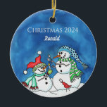 Snowmen Roasting Marshmellows Personalized Ornamen Ceramic Ornament<br><div class="desc">Capture the warmth of togetherness this holiday season with our charming Snowman Roasting Marshmallows Personalized Ornament. This delightful ornament feature two cheerful snowmen roasting marshmallows over a cozy campfire, personalized with your names or family name for a special touch. Whether hung on the tree or displayed as a centerpiece, celebrate...</div>
