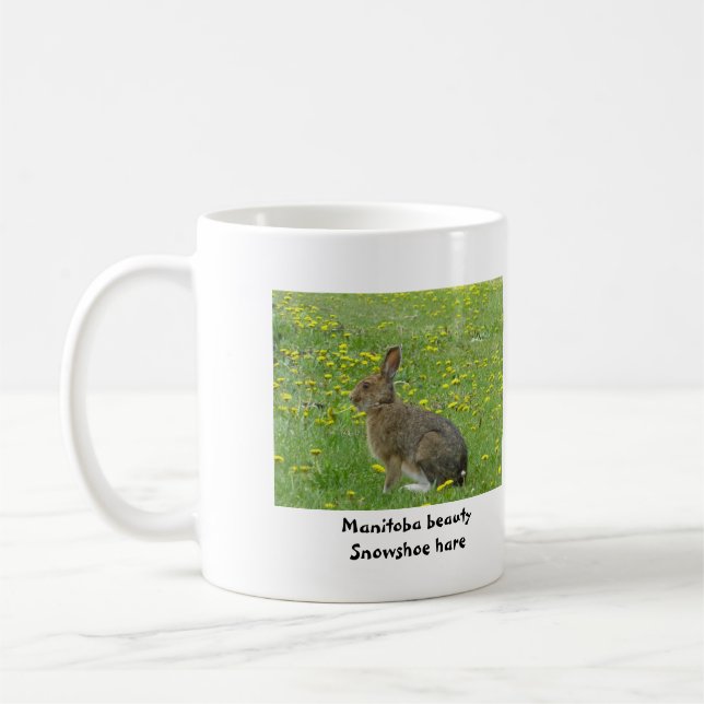 Snowshoe hare adores dandelions coffee mug (Left)