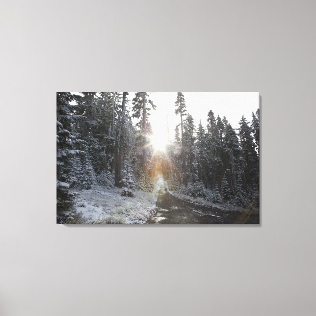 Snowy dirt road going into the sun canvas print (Front)