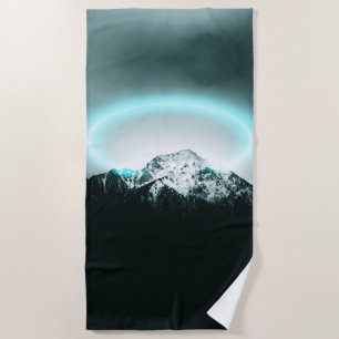 Snowy mountain mysterious blue neon light beach towel