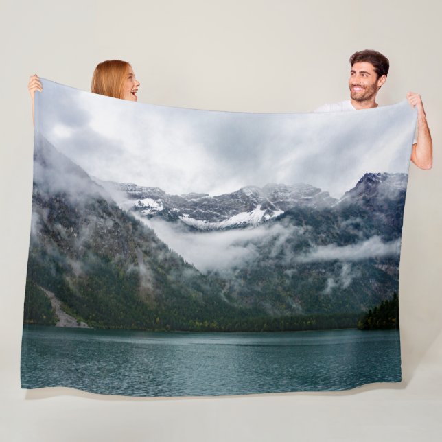 Snowy mountains in the fog at Plansee lake  Fleece Blanket (In Situ)
