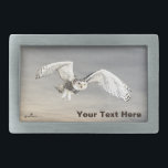 Snowy Owl Belt Buckle<br><div class="desc">A digital rendering of a Snowy Owl (Bubo scandiacus) superimposed on a wintery, grey sky background. Add your own text. The ground-nesting Snowy Owl is endemic to the Arctic regions of North America and Eurasia. Males are almost pure white, while females, as in this image, have more dark flecks and...</div>