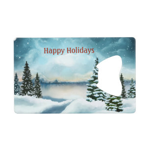Snowy pine trees near a lake credit card bottle opener