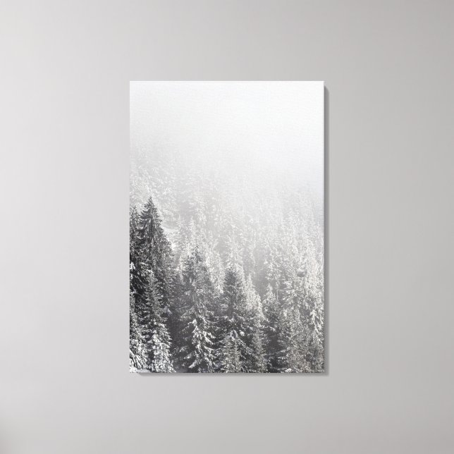 Snowy spruce forest wrapped in fog canvas print (Front)